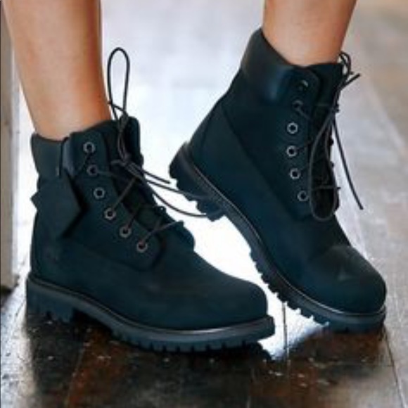 black timberland boots on feet